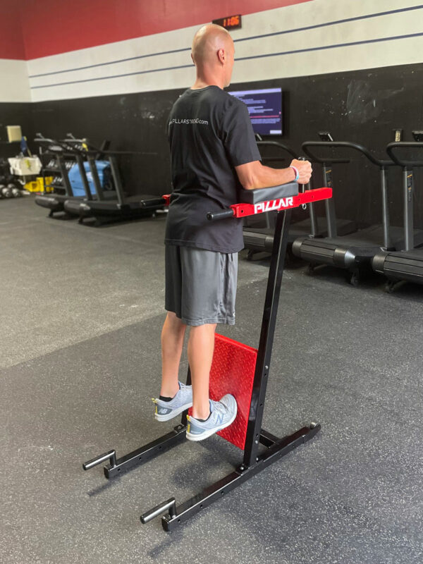 Person doing a vertical plank using Pillar Strong gym equipment