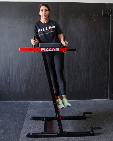 Person using Pillar Vertical Plank System