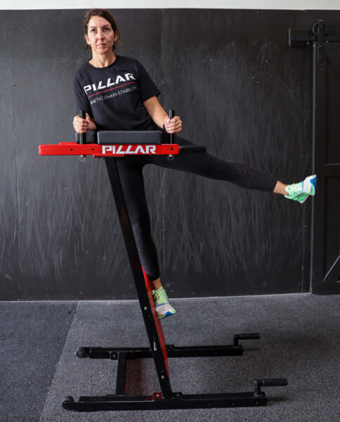 Person using Pillar Vertical Plank System